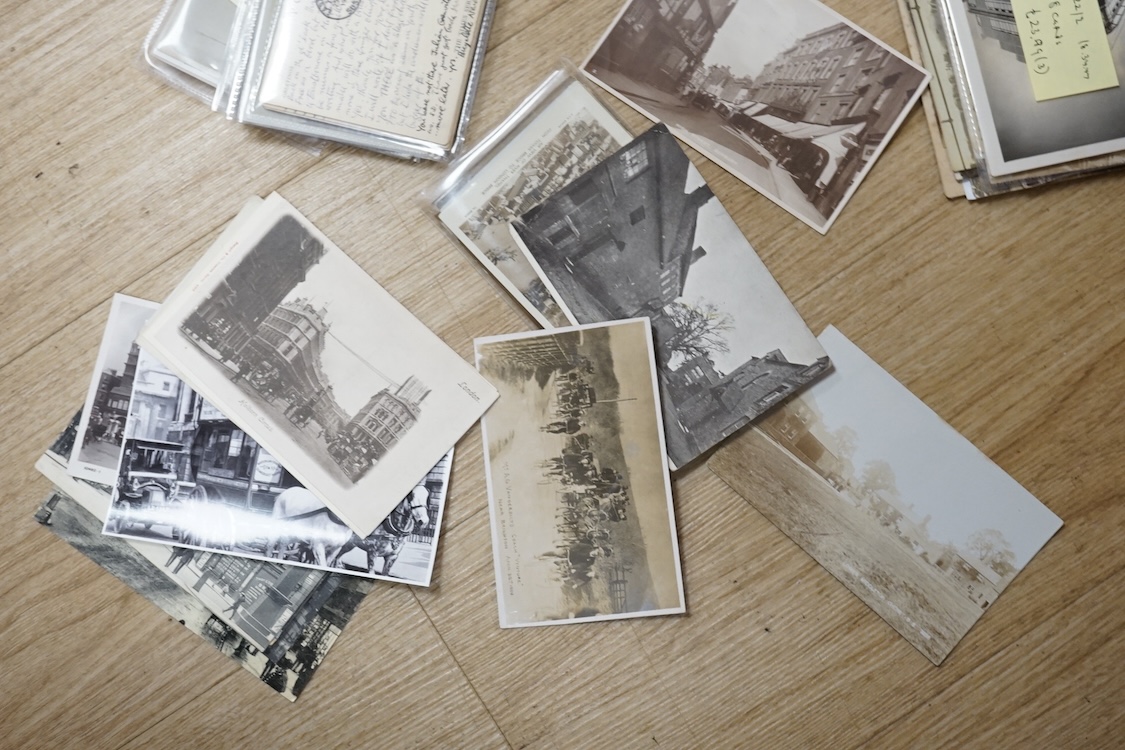 A collection of early 20th century postcards, photographs, etc. Including three albums of novelty postcards, scenes of London, etc. First World War postcards, etc. and an Edwardian photograph album, together with four bo